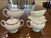 Full set showing teapot, sugar, creamer, gravy boat and stand