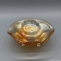Top view showing ribbed sunburst interior and beaded rim