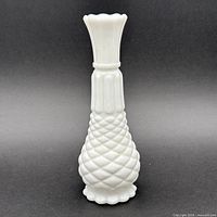 Full front view of milk glass vase showing overall form