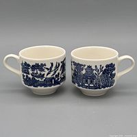 Front view of both Blue Willow tea cups showing pattern and handles