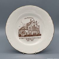 Front of plate showing church illustration, text and gold rim