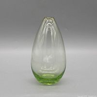 Front view of teardrop green-to-clear glass vase