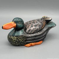 Left side view of ceramic duck decoy showing colours and feather detailing