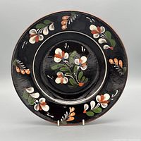 Front view of floral folk earthenware plate