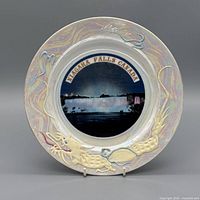 front view showing Niagara Falls image, iridescent glaze and dragon motif