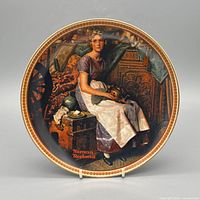 Front of Norman Rockwell decorative plate showing artwork and gold rim