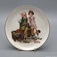 Front view showing complete illustration and gold rim