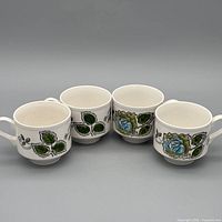 Front view of four Broadhurst Lee Ann Rose tea cups