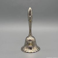 Front view of silver-plated fluted hand bell