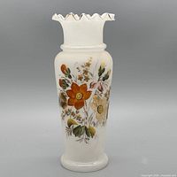 front view showing floral design and ruffled gilt rim