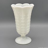 Full front view of white milk glass vase