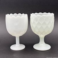 Front view of both milk glass goblets side by side