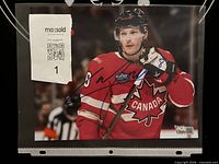 Front view of signed Cale Makar 8x10 photo in sleeve showing signature