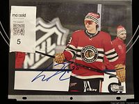 Full view of signed 8x10 Connor Bedard photo in sleeve
