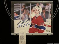 Front view of signed Patrick Roy 8x10 photo in protective sleeve