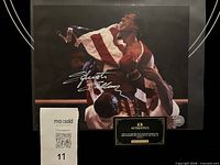 Full view of signed 8x10 photo with COA card