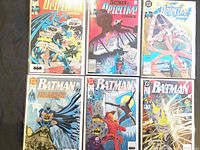 Group shot of all six bagged comic books