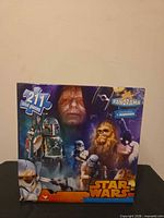 Front of Star Wars panorama puzzle box showing character collage and 211 total pieces label