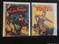 Front covers of both comic books in sleeves