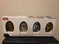 Boxed set front showing four character windows
