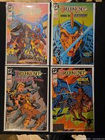 All four bagged Dragonlance issues laid out