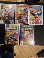 All five bagged and boarded comics laid out