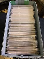 Top view of short box filled with bagged comics