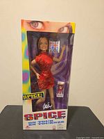 Front view of sealed Spice Girls Geri Halliwell doll box showing doll and accessory