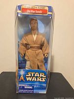 Front view of boxed Obi-Wan Kenobi figure
