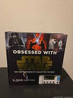 Front cover showing title, Star Wars imagery, and built-in quiz unit