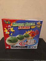 Front of boxed Super Mario Hover Shell Strike game