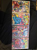 Four variant cover comics laid out