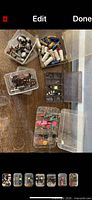 Group of six plastic organizers filled with electronic parts