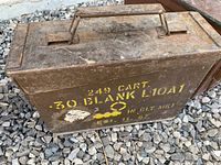 Stenciled olive drab ammo box side view