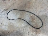 Full view of uninstalled serpentine belt laid out on floor