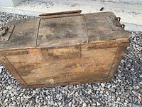 Top view showing hinged lid, metal handles and clasp