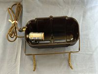 Top view showing Bakelite housing, socket, brass stand, cloth cord