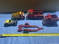 Group shot of all five vehicles with ruler for scale