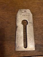Front of blade showing maker stamp and keyhole-slot