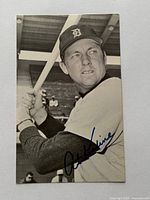 Front of signed photo showing Al Kaline batting pose and autograph
