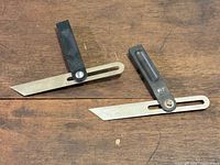 Both bevel squares open showing blades and handles