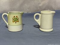Both creamers front view, showing floral design and ivory crackle glaze