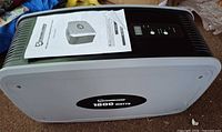 Front and top view of power system with manual showing brand and wattage