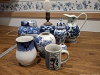 Group shot of all eight blue and white porcelain items