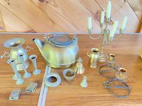 Full lot overview showing kettle, candelabrum, sconces, candlesticks, jug, vase, small pieces