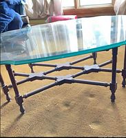 Full view showing glass top and wood base