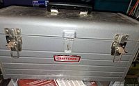 Front of gray Craftsman toolbox with latches and handle