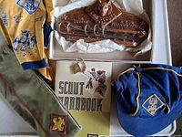 Overview of lot showing neckerchief, sash, key rack, handbook and keychain