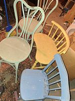 All four chairs grouped together showing colors and styles