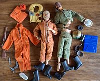 Overview of both GI Joe figures with clothing and scattered accessories